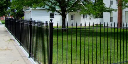 a picture of an black iron fence