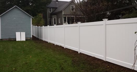 a picture of a white vinyl fence